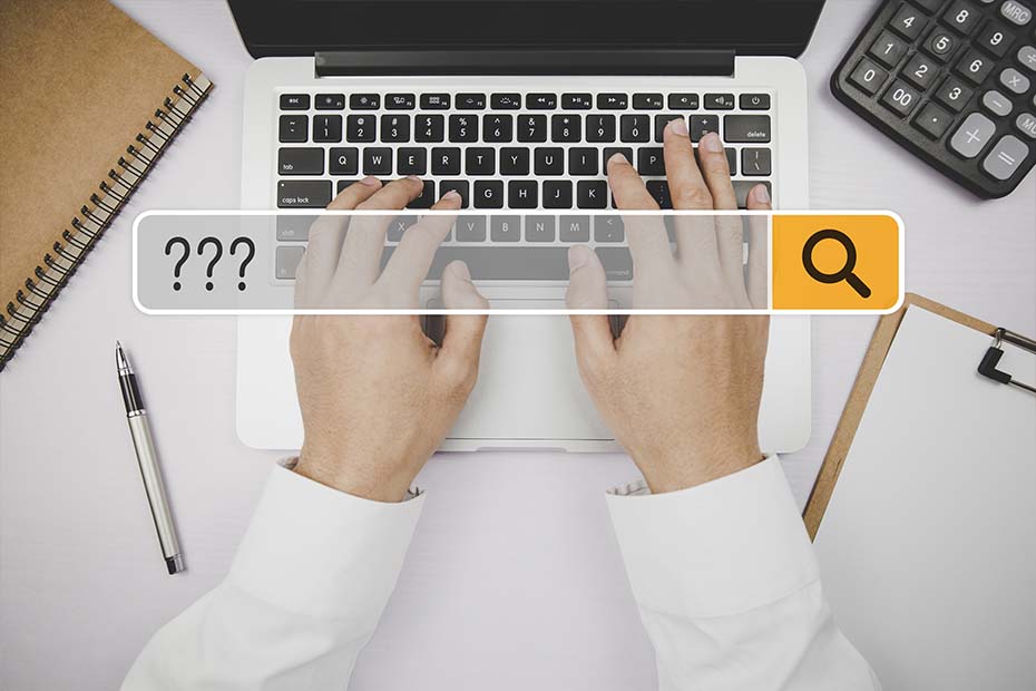 Search Bar shown over hands typing - decorative image for Frequently Asked Questions page